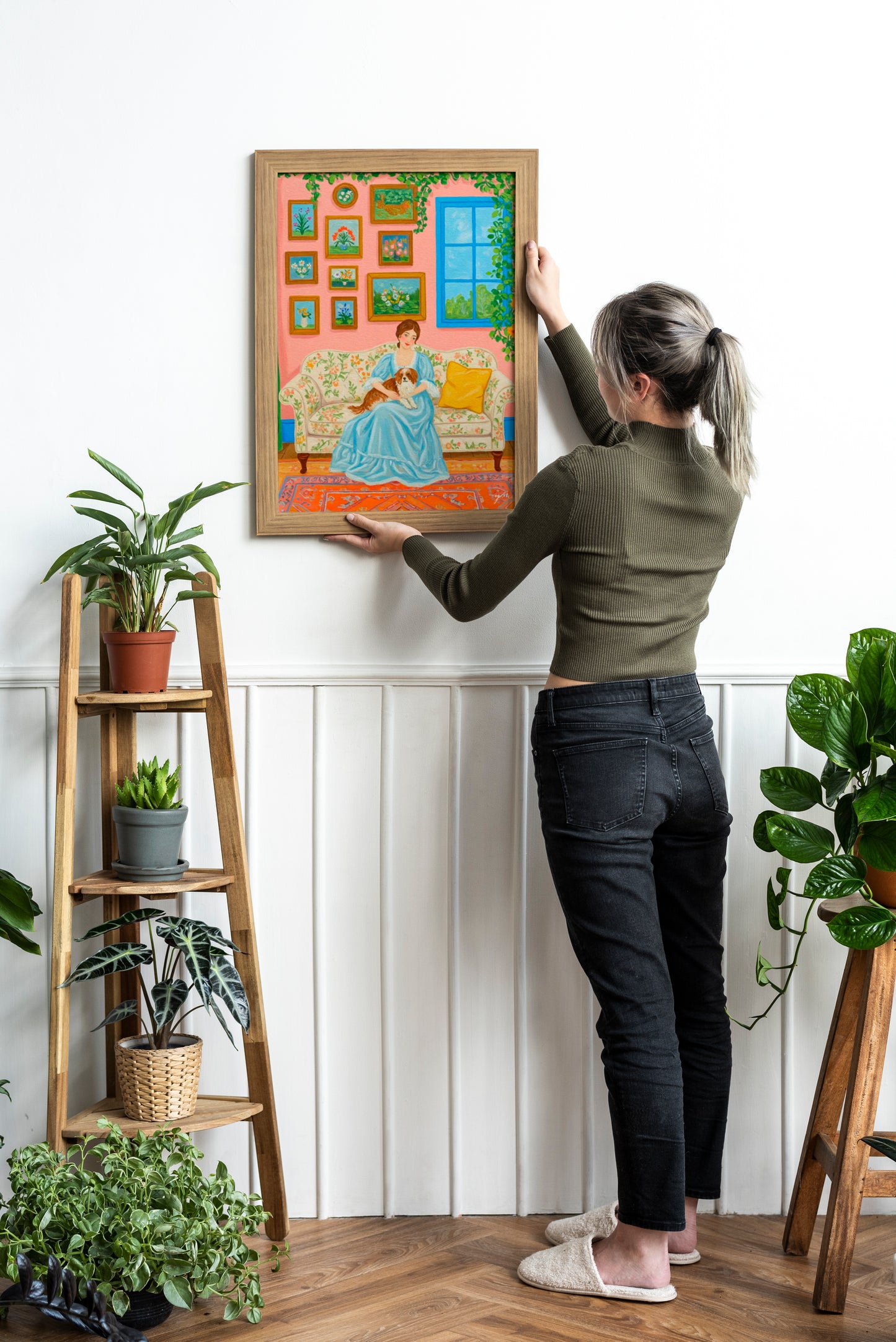 Woman in Blue Lounge Dress Holding Dog on Floral Sofa – Peaceful Colorful Art in Pink Room Interior Poster