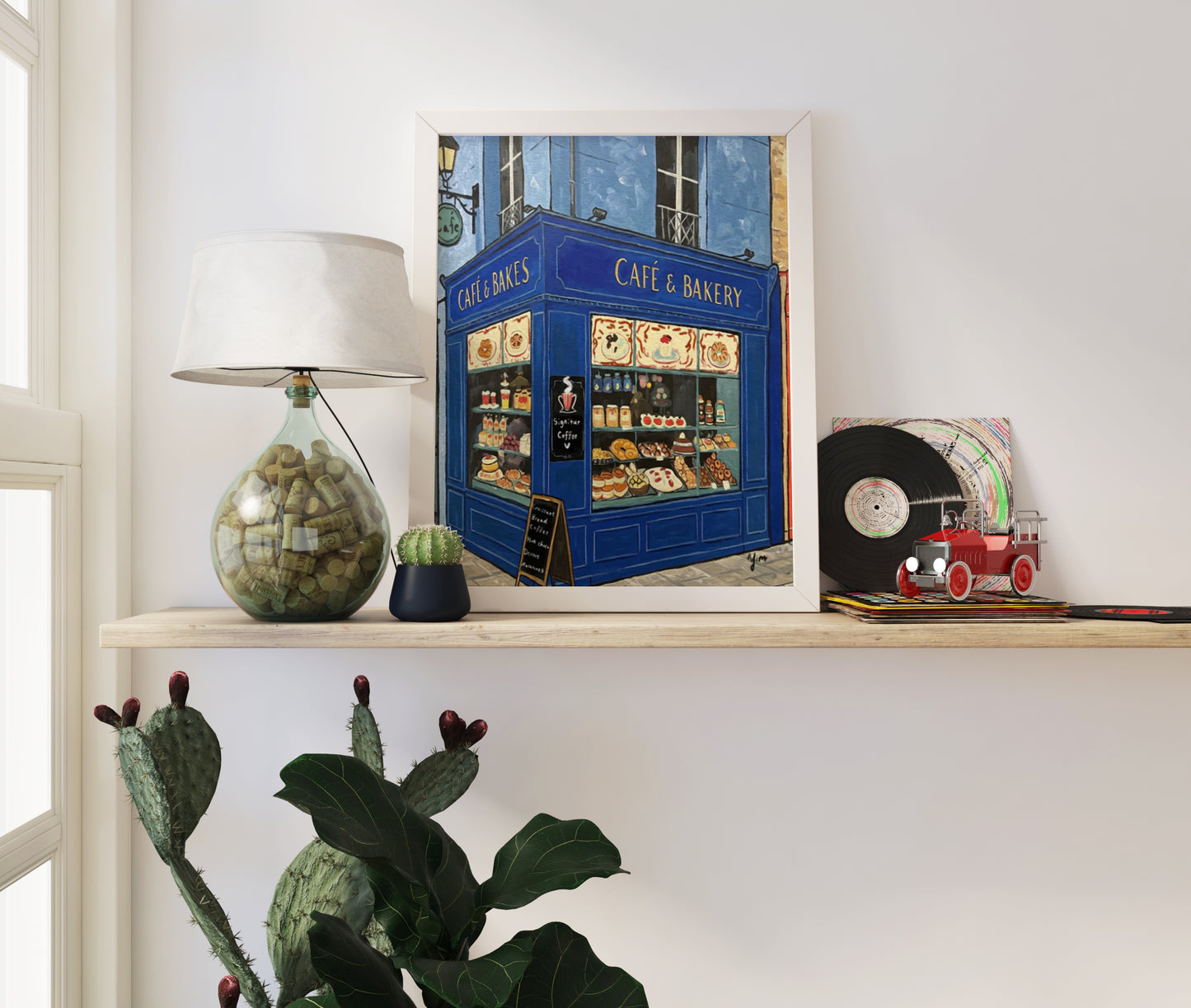 Whimsical blue Parisian café and bakery illustration with bread and pastries on a charming French street, perfect for kitchen wall decor
