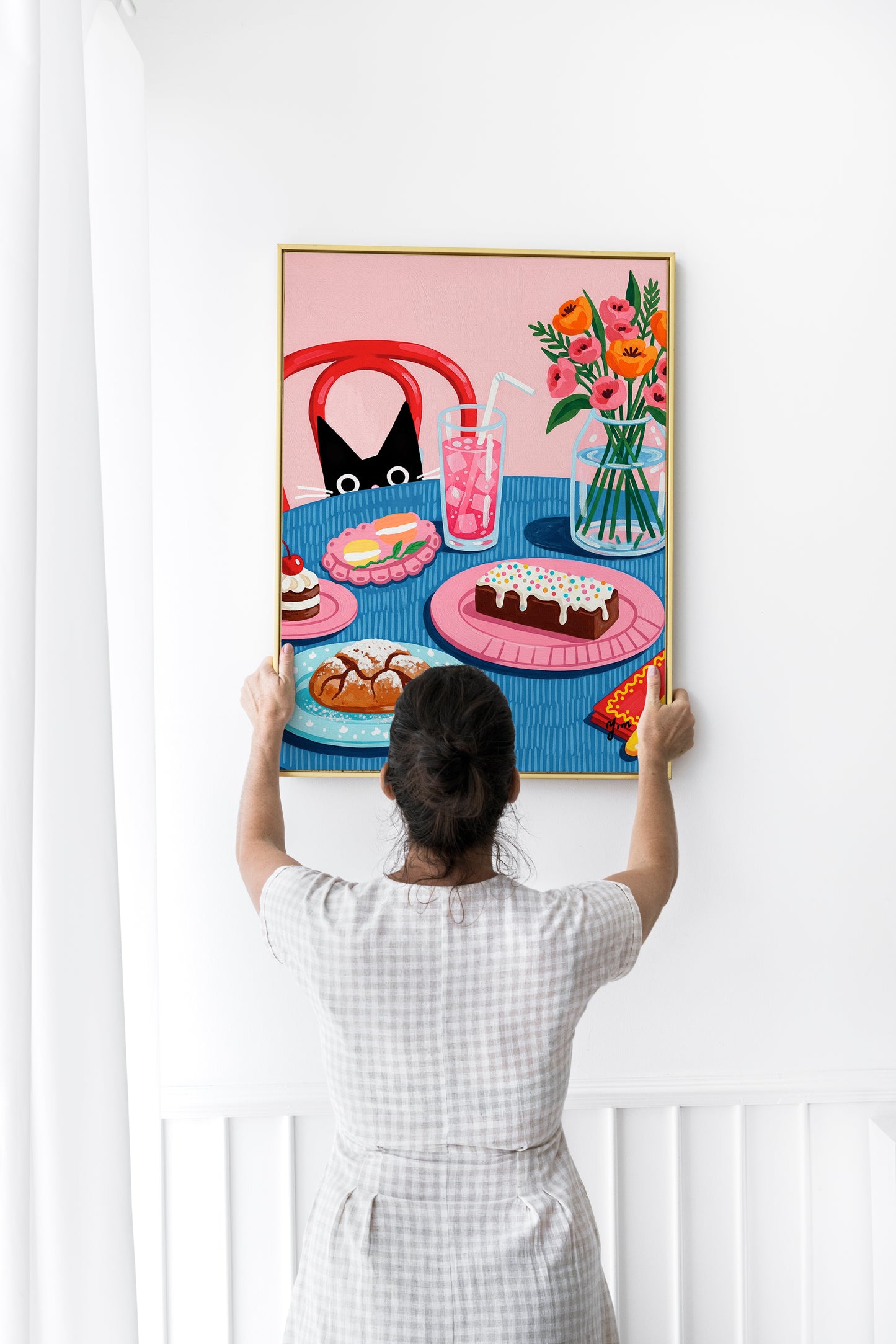 The “Curious Cat Dessert Table Art Print” features an adorable cat gazing curiously at a whimsical dessert table, illustrated with delicate and vibrant floral elements. The print showcases a variety of colorful sweets such as cakes, cupcakes, and macarons, rendered with detailed brushstrokes and bright pastel tones. The cat’s charming expression and the floral decorations on the table create a warm and enchanting atmosphere. This artwork blends soft colors and intricate details to bring life and cheerfulnes