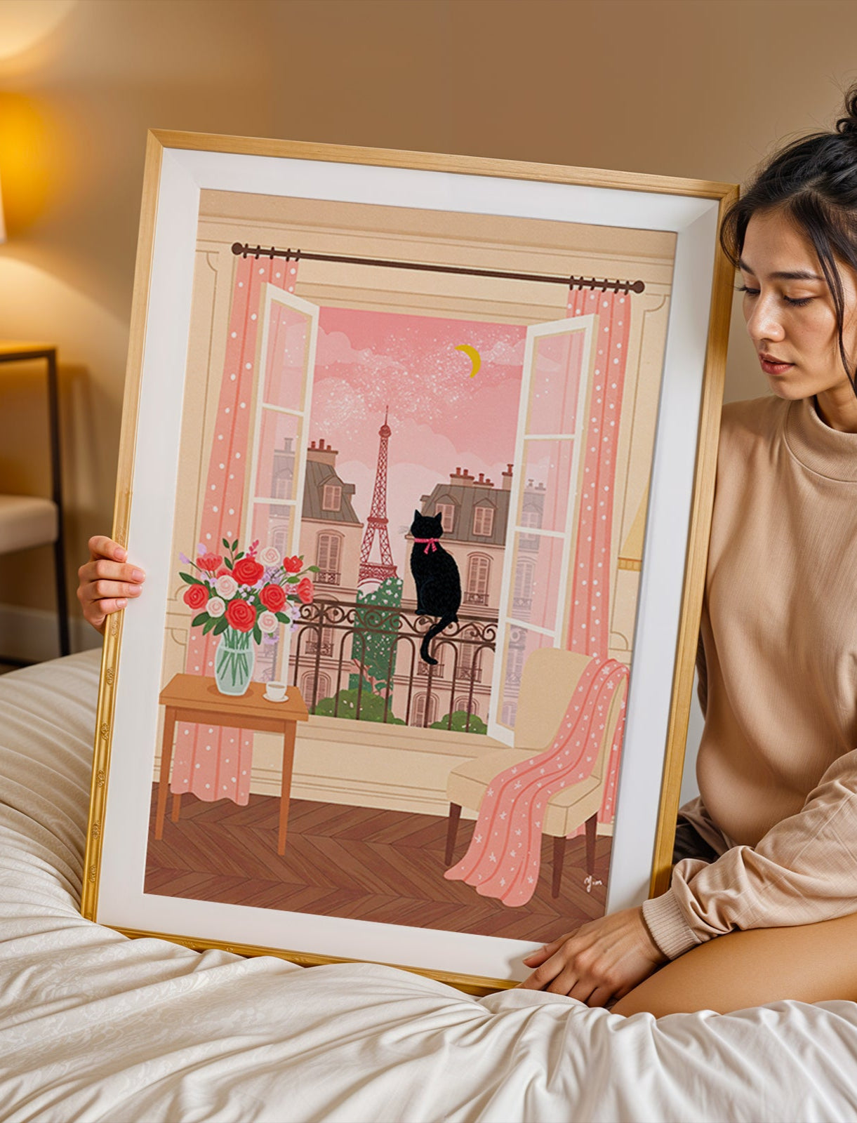 An illustration of a black cat with a pink ribbon sitting on a balcony, looking out at the Eiffel Tower through open windows, with pink curtains, flowers, and a cozy interior