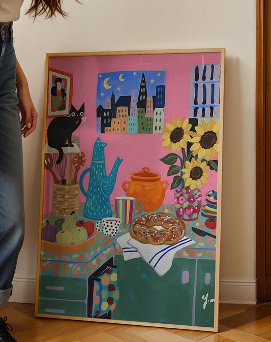 A whimsical colorful kitchen scene featuring a black cat sitting on utensils, bright sunflowers, patterned dishes, and a braided pastry on a counter by YunaMoona.