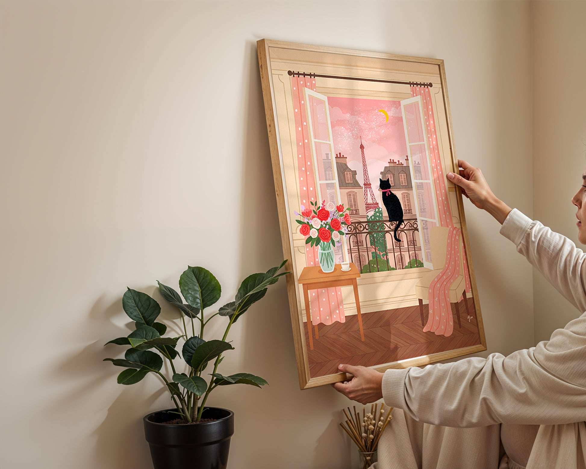 An illustration of a black cat with a pink ribbon sitting on a balcony, looking out at the Eiffel Tower through open windows, with pink curtains, flowers, and a cozy interior
